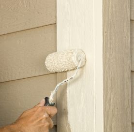 House Painter Rolling Siding Trim Board